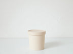 ホーンプリーズECOキャニスター、アイボリーとグレーの筒形プラスチック製陶磁器風容器。環境に優しい素材でキッチン収納に最適