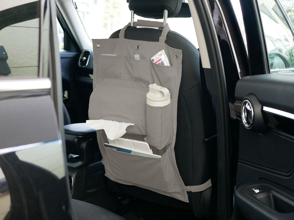 Horn Please MADEの綿100％キャンバス製ハンギングアレンジメントポケット。縦40cm、高さ60cmで複数の収納ポケットが配置されたデザイン。インド製