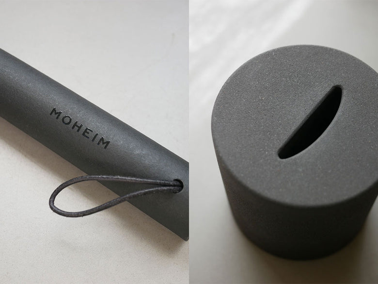 MOHEIM（モヘイム）製シューズホーン。シルバーのバルカナイズドファイバー製円筒本体とコンクリート製土台のセット