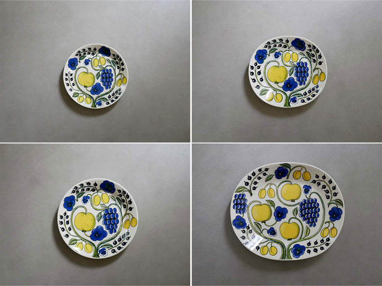 アラビア製の黄色と青の磁器プレートがテーブル上に並べられている画像