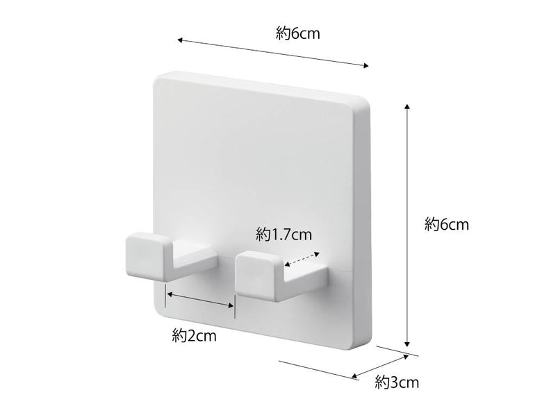 ABS樹脂製の【MIST/ミスト】フィルムフック シェーバーホルダーが光沢のある平らな壁面に取り付けられている様子