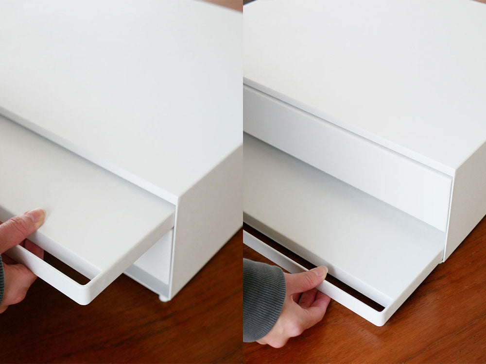 灰色のタワー型家具に複数の引き出しとスライドテーブルが組み込まれており、オフィスやキッチンで家電や用品を整理するのに適したデザイン。