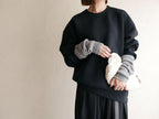 memeri「メメリ」カシミヤコットン製アーム＆レッグウォーマー。ブラックとグレーのファッショナブルなデザイン
