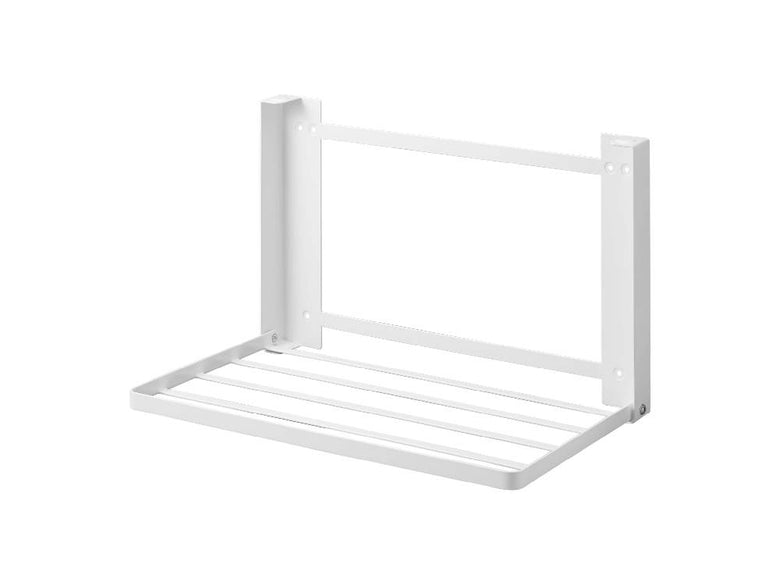 石こうボード壁に取り付けられた【tower/タワー】折り畳み棚。スチール製で家庭用として使用されているシェルフ