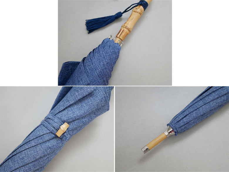 ビコーズのネイビー色プレーンカラー傘。ポリエステル製生地に鉄製の骨とバンブーハンドルを使用したデザイン