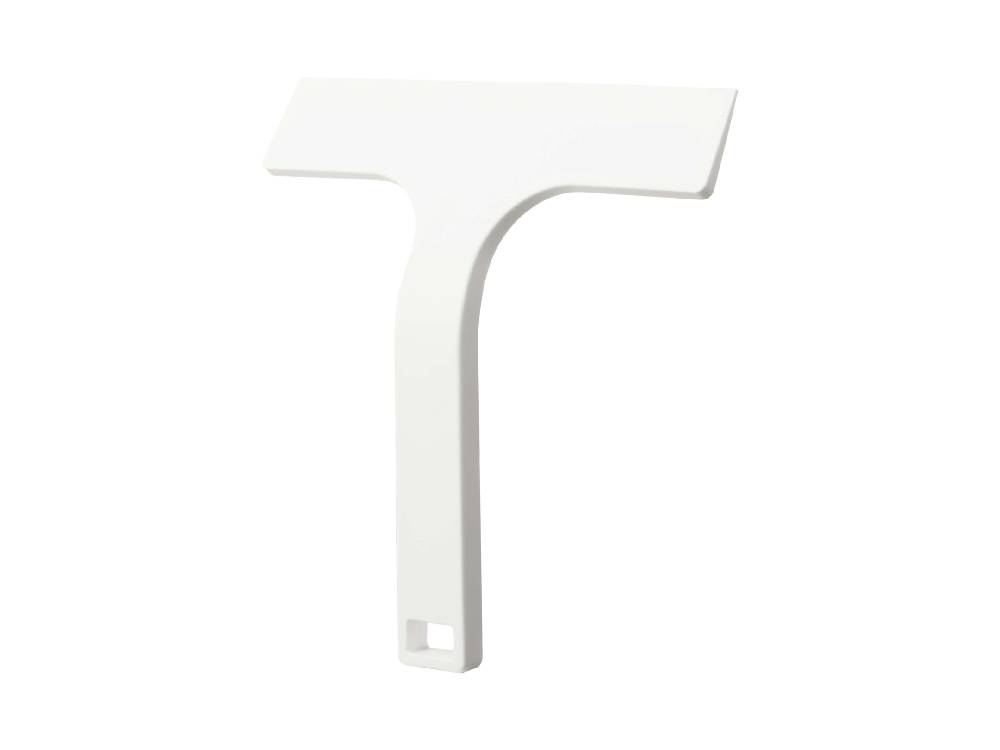 白色のマグネット水切りワイパー Sがスチール壁面に取り付けられている様子