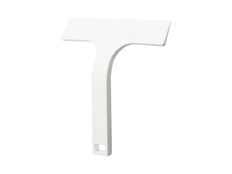 白色のマグネット水切りワイパー Sがスチール壁面に取り付けられている様子