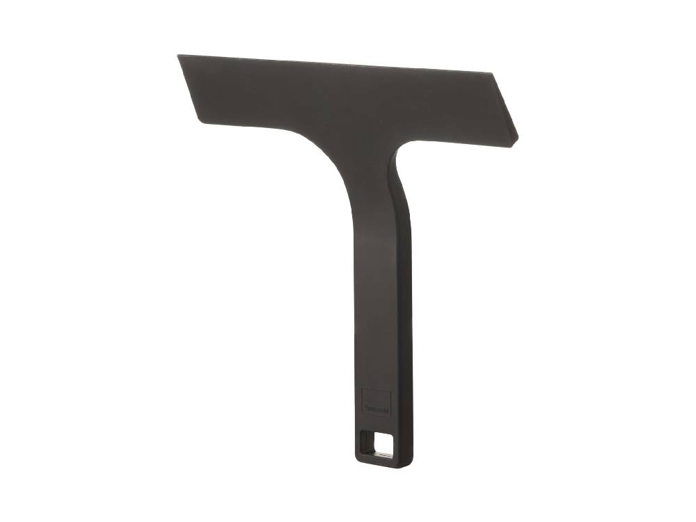 シリコーンとマグネット製の【tower/タワー】マグネット水切りワイパー Sがスチールの壁面に取り付けられている様子