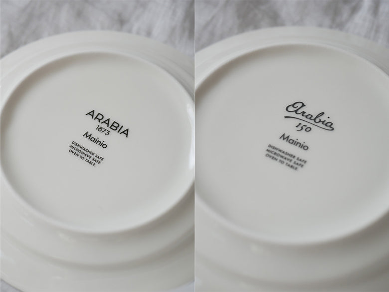 アラビアのマイニオ ボウル、ベージュ色の磁器製で13cmと17cmの二サイズが並び、ルーマニア製の150周年記念バックスタンプが入っています