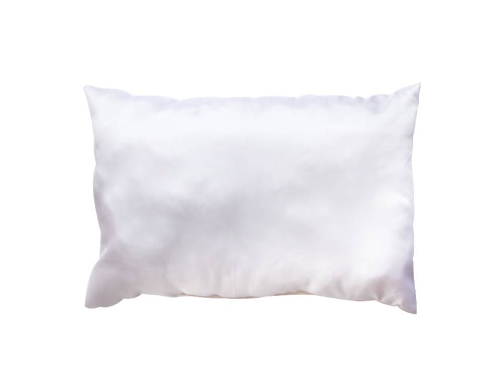 白いリネン製クッションとスローピローが配置されたアデペシュのフレンチリネンソファ