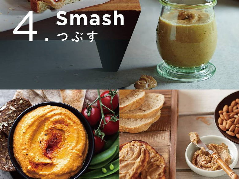 Vitamixブレンダーと各種食材、調味料、食器がキッチンテーブルに並べられている様子