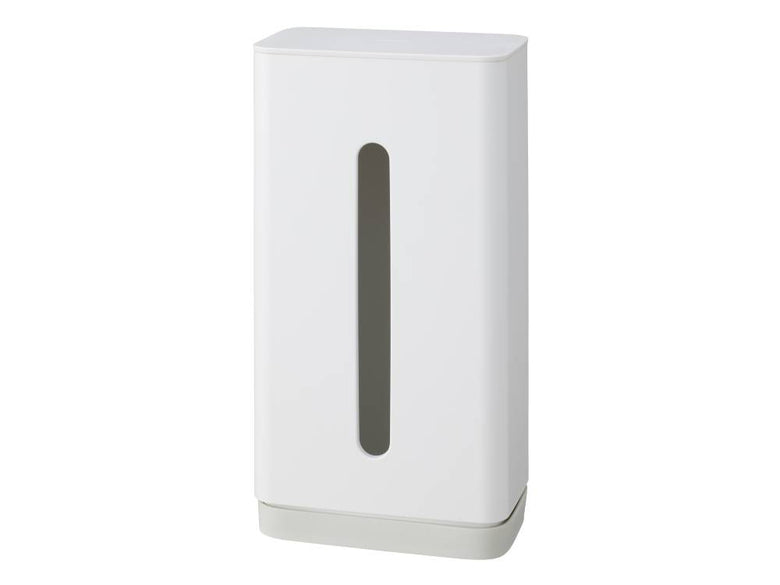 マーナ製の吸盤式ティッシュケースが光沢のある平らな表面に固定され、片手で簡単にティッシュを取り出せる様子